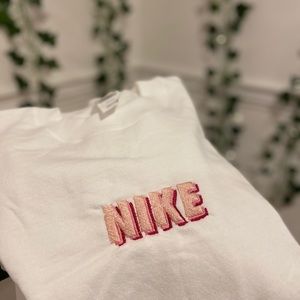 pink nike embroidered crewneck